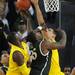 Michigan junior Tim Hardaway Jr. and freshman Mitch McGary attempt to block Michigan State senior Derrick Nix as he takes a shot in the second half against Michigan State at Crisler Center on Sunday, March 3, 2013. Melanie Maxwell I AnnArbor.com